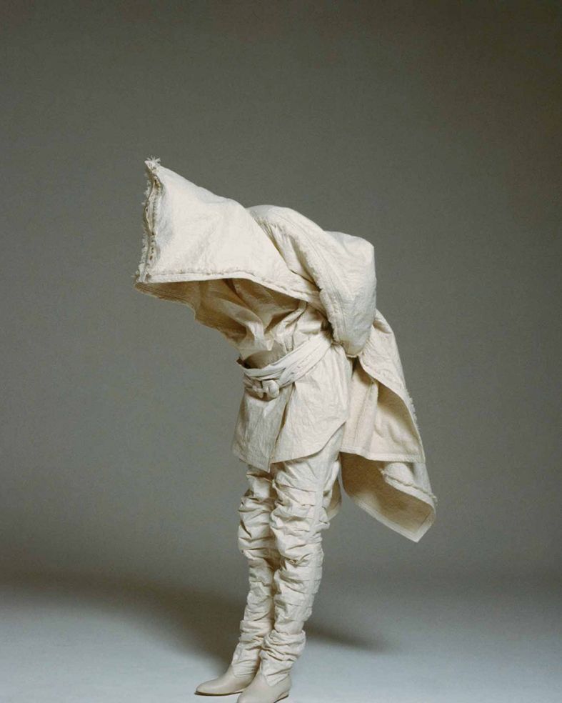 Sculpture, Paper, Costume design, Costume accessory, Fictional character, Figurine, Action figure, Paper product, 
