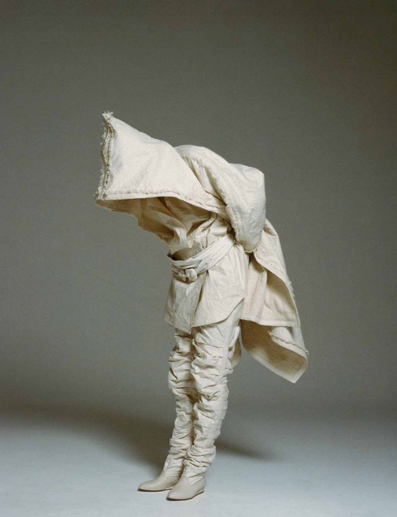 Sculpture, Paper, Costume design, Costume accessory, Fictional character, Figurine, Action figure, Paper product, 