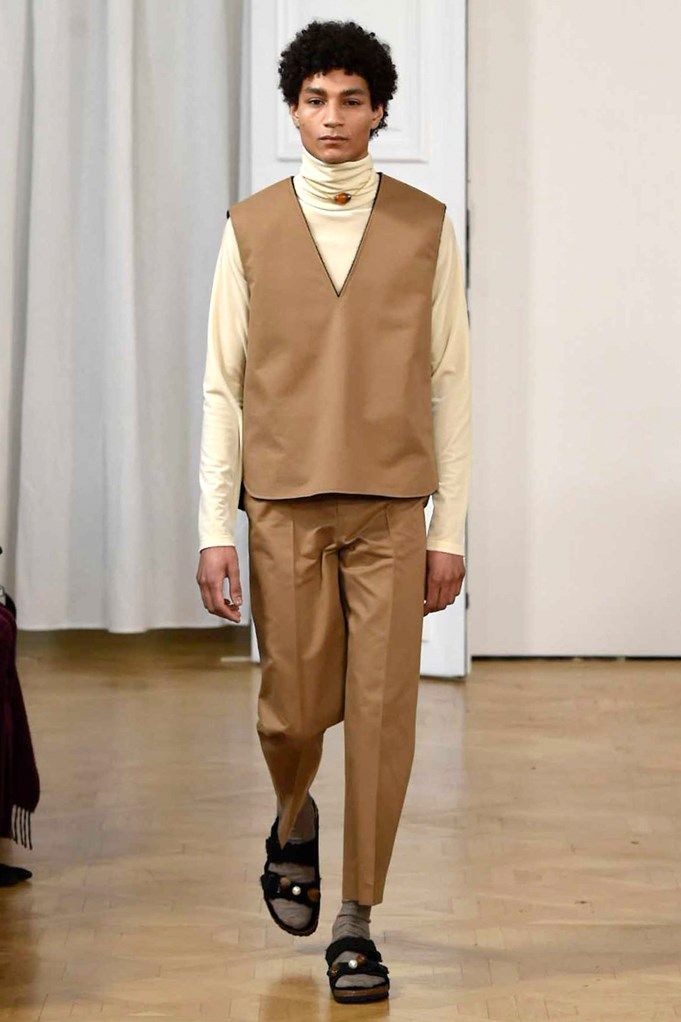 Brown, Sleeve, Trousers, Floor, Textile, Flooring, Collar, Outerwear, Fashion show, Style, 