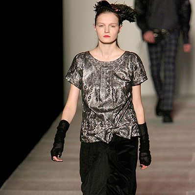 Clothing, Brown, Human body, Shoulder, Textile, Joint, Outerwear, Fashion show, Style, Floor, 