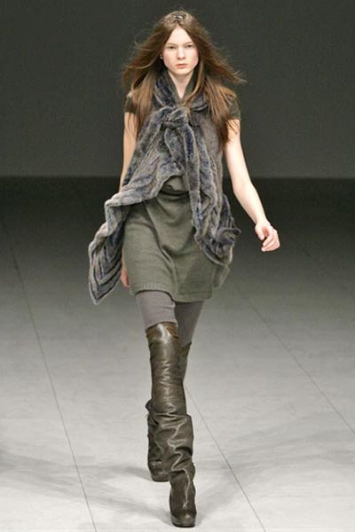 Clothing, Human, Brown, Human body, Shoulder, Fashion show, Textile, Joint, Outerwear, Boot, 