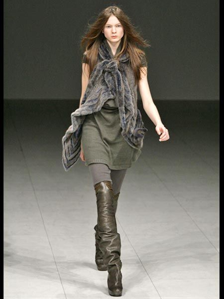 Clothing, Human, Brown, Human body, Shoulder, Fashion show, Textile, Joint, Outerwear, Boot, 