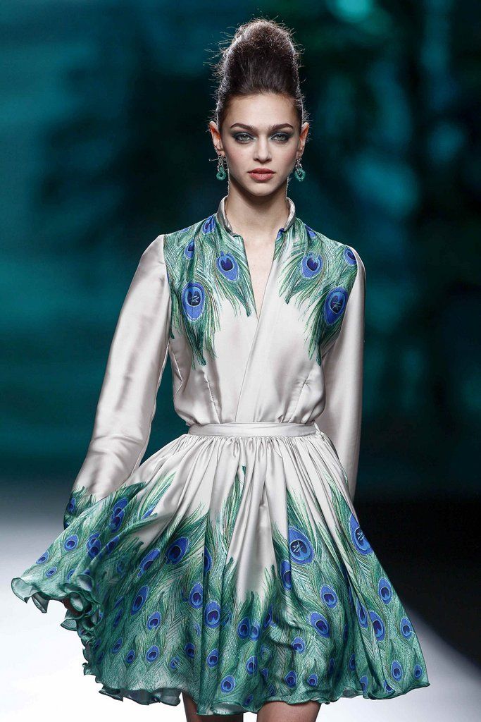 Clothing, Face, Blue, Green, Textile, Fashion show, Style, Earrings, Fashion model, One-piece garment, 