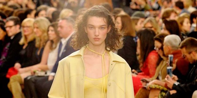 Fashion, Fashion show, Fashion model, Runway, Clothing, Yellow, Shoulder, Haute couture, Event, Outerwear, 