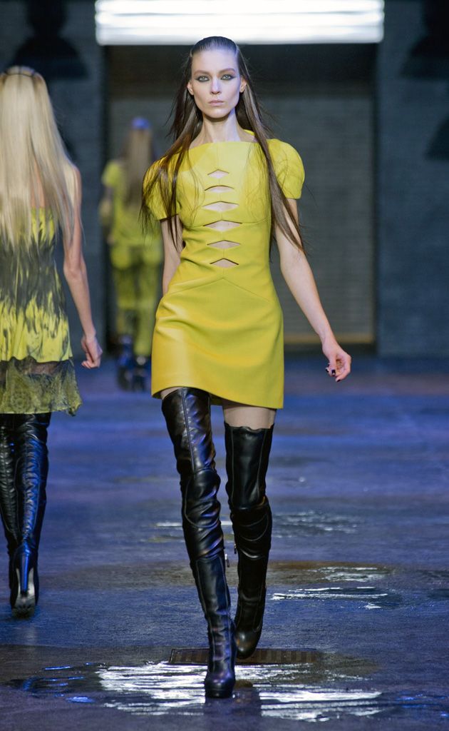 Clothing, Footwear, Yellow, Human body, Joint, Outerwear, Style, Fashion show, Street fashion, Boot, 
