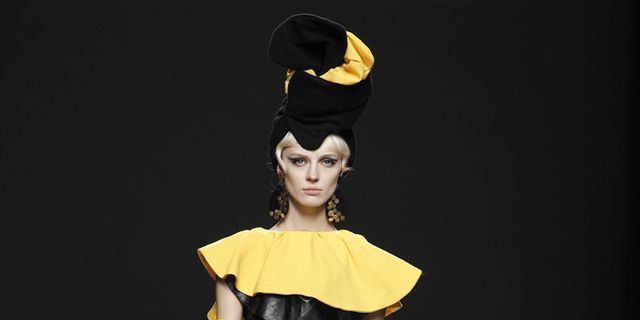 Yellow, Style, Costume design, Headgear, Costume accessory, Fashion, Waist, Fashion model, Toy, Fashion design, 