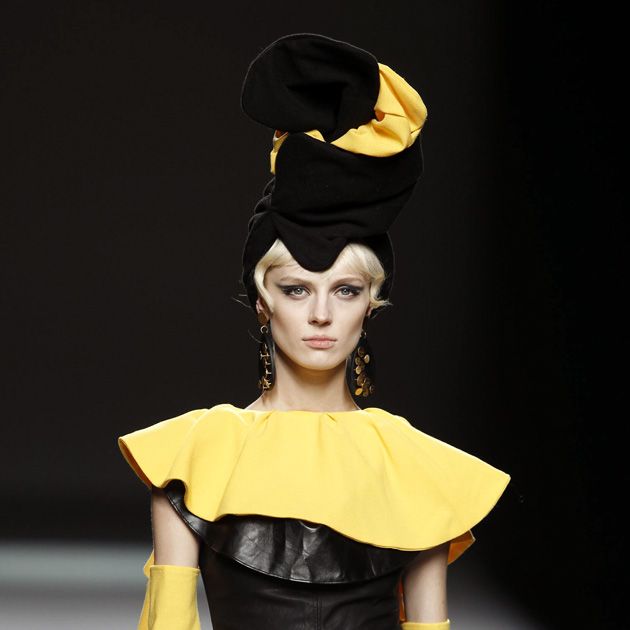 Yellow, Hairstyle, Sleeve, Shoulder, Joint, Style, Headgear, Costume accessory, Fashion, Costume design, 
