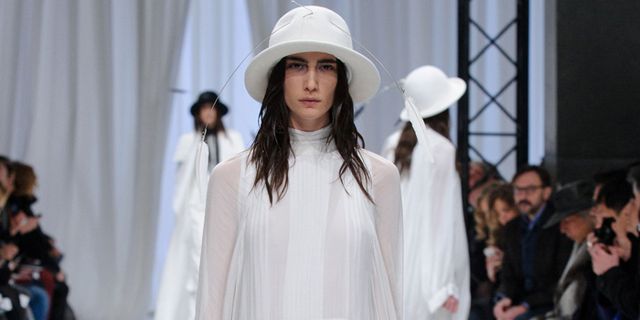 Clothing, Event, Shoulder, Hat, Fashion show, Outerwear, Style, Fashion model, Runway, Headgear, 