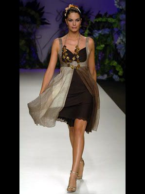 Clothing, Hairstyle, Shoulder, Dress, Human leg, Joint, Formal wear, Fashion show, One-piece garment, Style, 