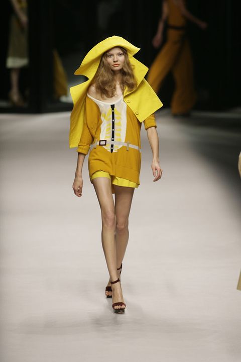 Yellow, Fashion show, Shoulder, Runway, Human leg, Joint, Waist, Style, Fashion model, Fashion accessory, 