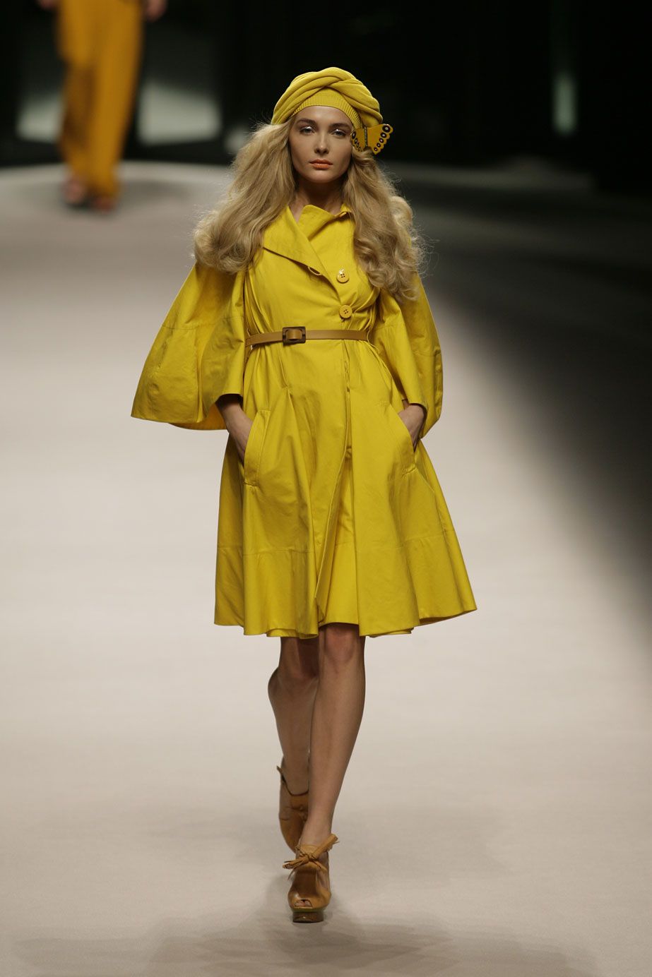 Yellow, Sleeve, Human leg, Joint, Dress, Fashion show, Fashion model, Street fashion, Runway, One-piece garment, 