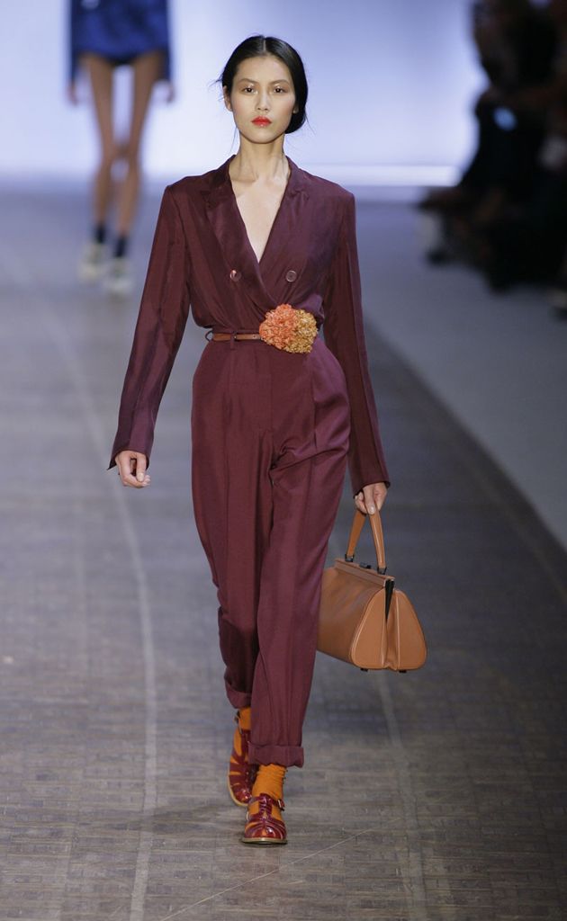 Clothing, Brown, Human body, Shoulder, Fashion show, Joint, Outerwear, Style, Bag, Formal wear, 