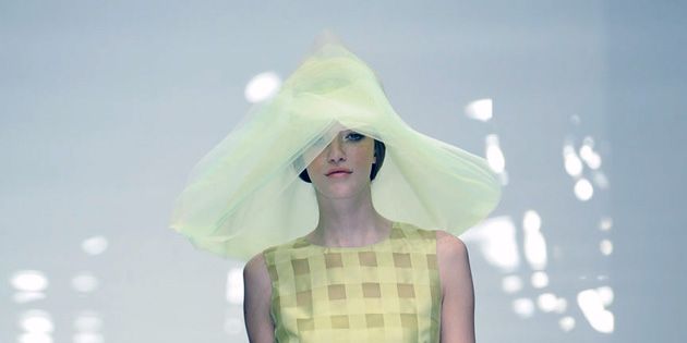 Clothing, Dress, Hat, Shoulder, Human leg, Fashion show, Joint, One-piece garment, Fashion model, Runway, 