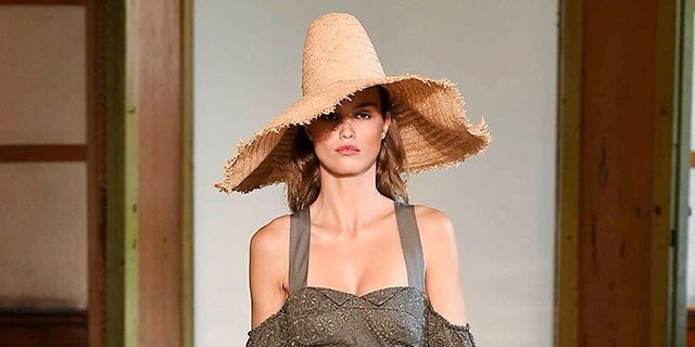 Hat, Brown, Shoulder, Fashion show, Joint, Floor, Flooring, Waist, Style, Fashion accessory, 