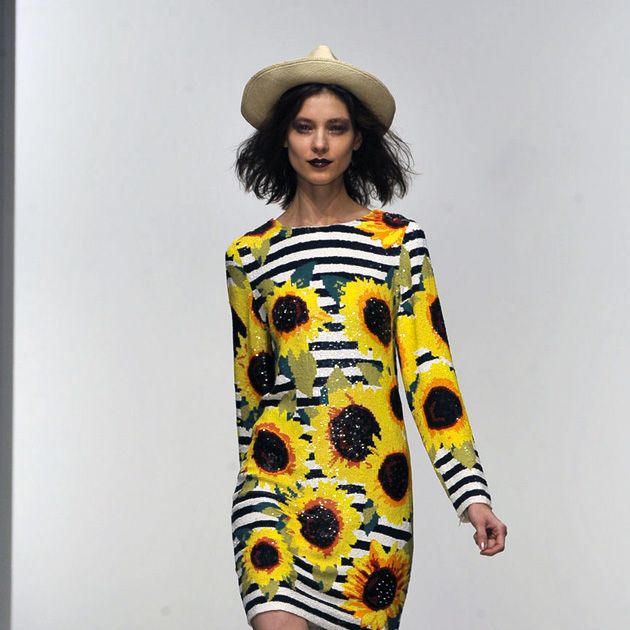 Yellow, Hat, Sleeve, Human body, Shoulder, Joint, Dress, Style, Fashion model, One-piece garment, 