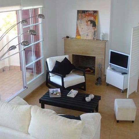 Wood, Room, Interior design, Property, Living room, Floor, Wall, Display device, Flooring, Home, 