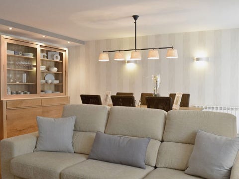 Room, Interior design, Brown, Wall, Furniture, Couch, Ceiling, Living room, Ceiling fixture, Floor, 