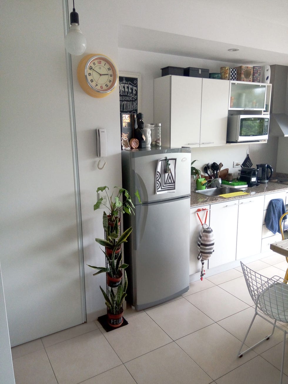 Room, Countertop, Interior design, Furniture, Floor, Wall clock, House, Fixture, Kitchen appliance, Kitchen, 