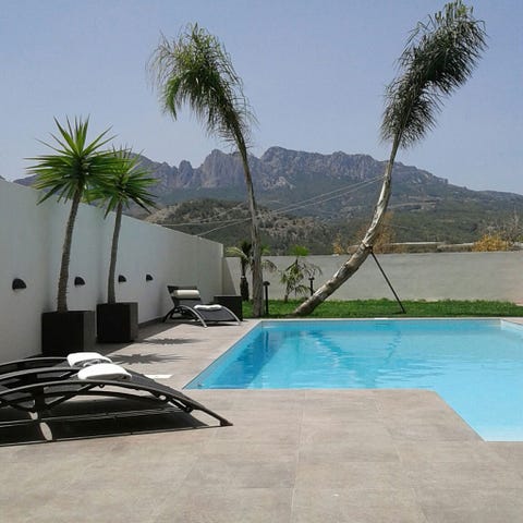 Swimming pool, Property, Real estate, Arecales, Aqua, Azure, Resort, Shade, Composite material, Tile, 