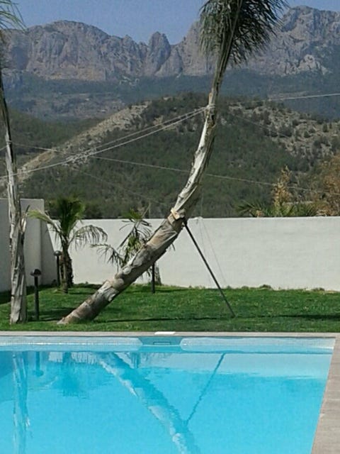 Nature, Fluid, Swimming pool, Mountainous landforms, Landscape, Mountain range, Mountain, Valley, Hill, Real estate, 