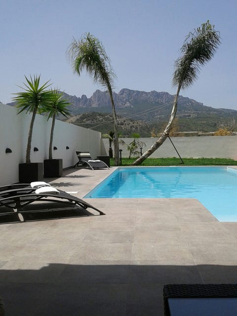 Swimming pool, Property, Water, Resort, Real estate, Aqua, Azure, Arecales, Composite material, Shade, 