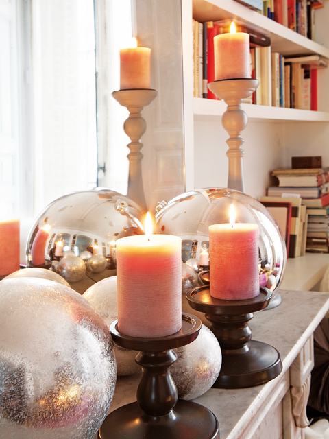 Lighting, Orange, Wax, Room, Bookcase, Candle, Shelf, Peach, Interior design, Amber, 
