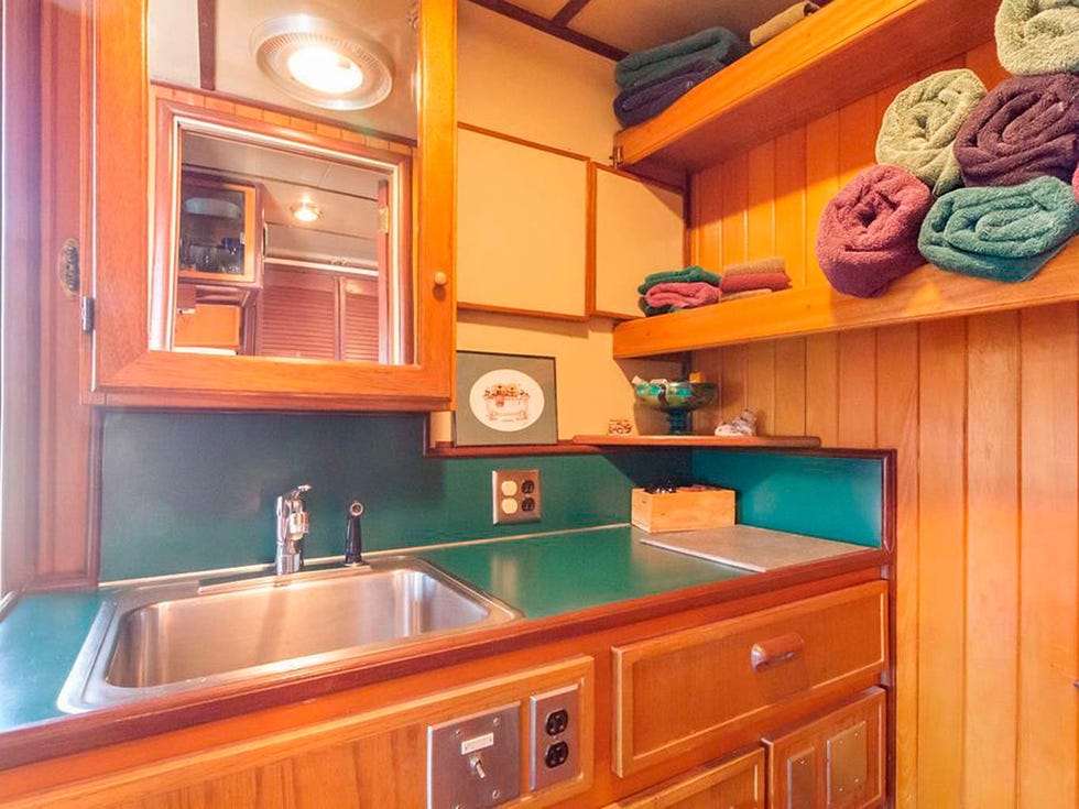 Room, Property, Turquoise, Cabinetry, Furniture, Kitchen, Countertop, Orange, Building, Interior design, 