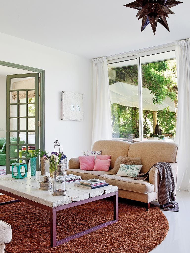 Living room, Furniture, Room, Interior design, Coffee table, Property, Green, Table, Home, Building, 