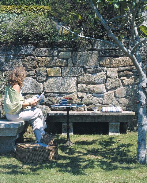 Sitting, Outdoor furniture, Stone wall, Lap, Guitar, Outdoor bench, Bench, Outdoor table, Park, Picnic, 