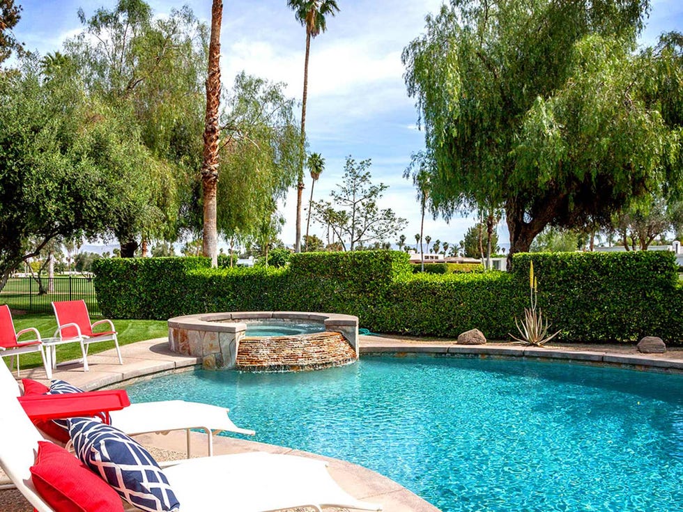 Swimming pool, Property, Outdoor furniture, Real estate, Resort, Chair, Composite material, Sunlounger, Garden, Shade, 