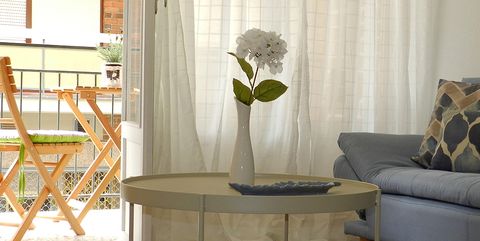 Furniture, Floor, Room, Interior design, Table, Coffee table, Living room, Curtain, Chair, Flooring, 