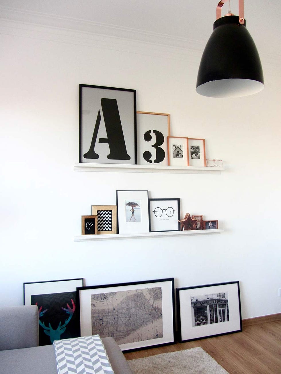 Room, Interior design, Wall, Light fixture, Interior design, Lighting accessory, Grey, Collection, Tints and shades, Picture frame, 