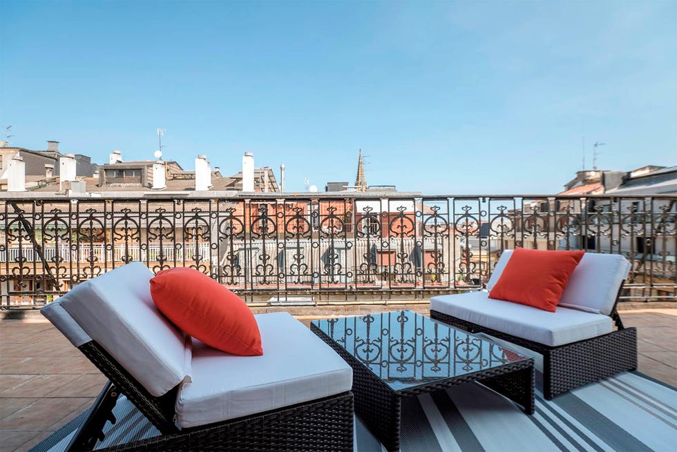Furniture, Outdoor furniture, Real estate, Outdoor sofa, Balcony, Outdoor table, Patio, Coffee table, studio couch, Pillow, 