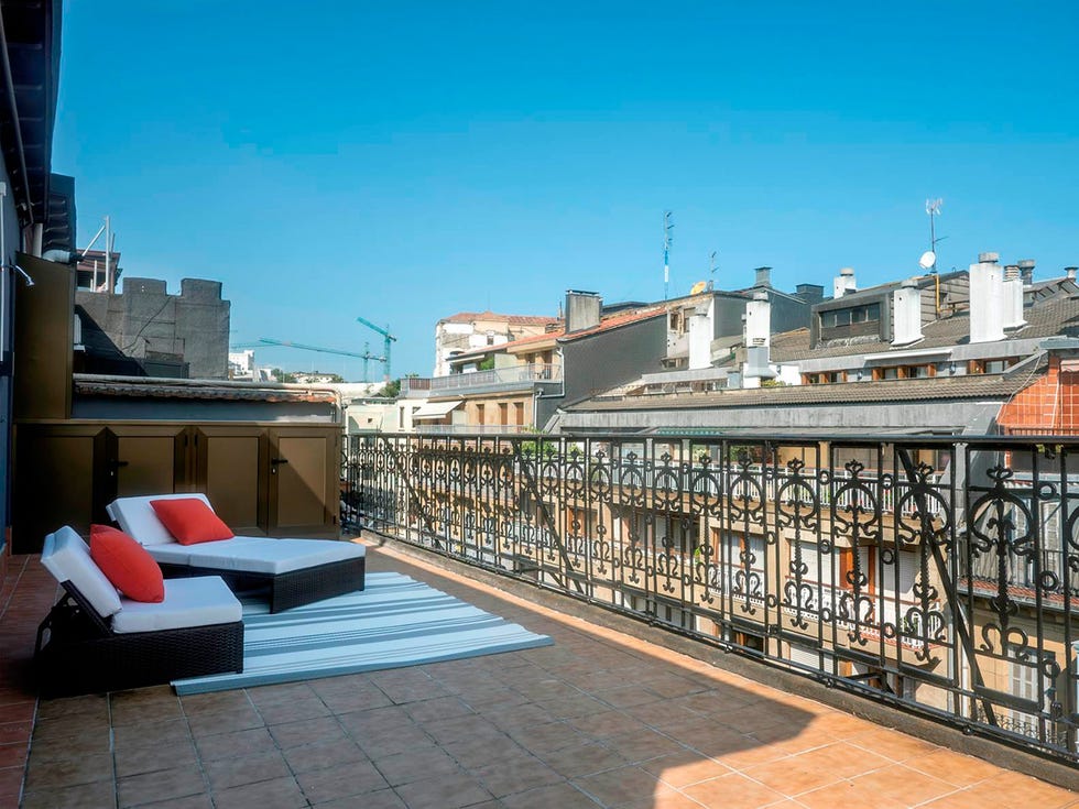 Outdoor furniture, Tile, Street light, studio couch, Pillow, Apartment, Couch, Balcony, Building material, Outdoor sofa, 