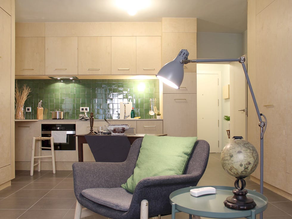 Room, Interior design, Living room, Furniture, Floor, Green, Property, Lighting, Light fixture, Wall, 