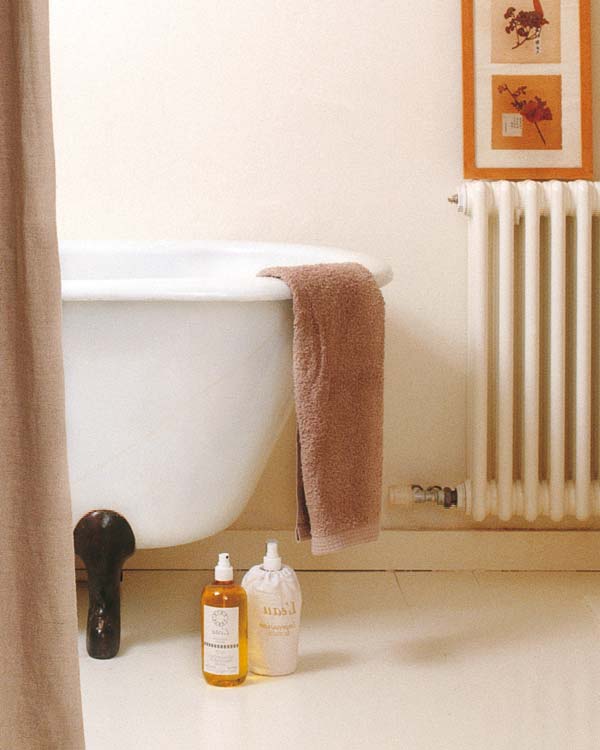Wall, Room, Interior design, Bottle, Plastic bottle, Beige, Peach, Tan, Glass bottle, Picture frame, 