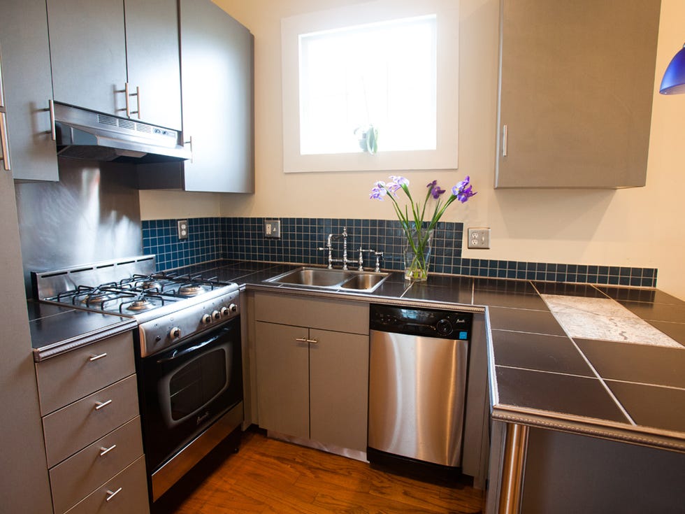 Countertop, Cabinetry, Kitchen, Room, Property, Furniture, Kitchen stove, Major appliance, Interior design, Floor, 