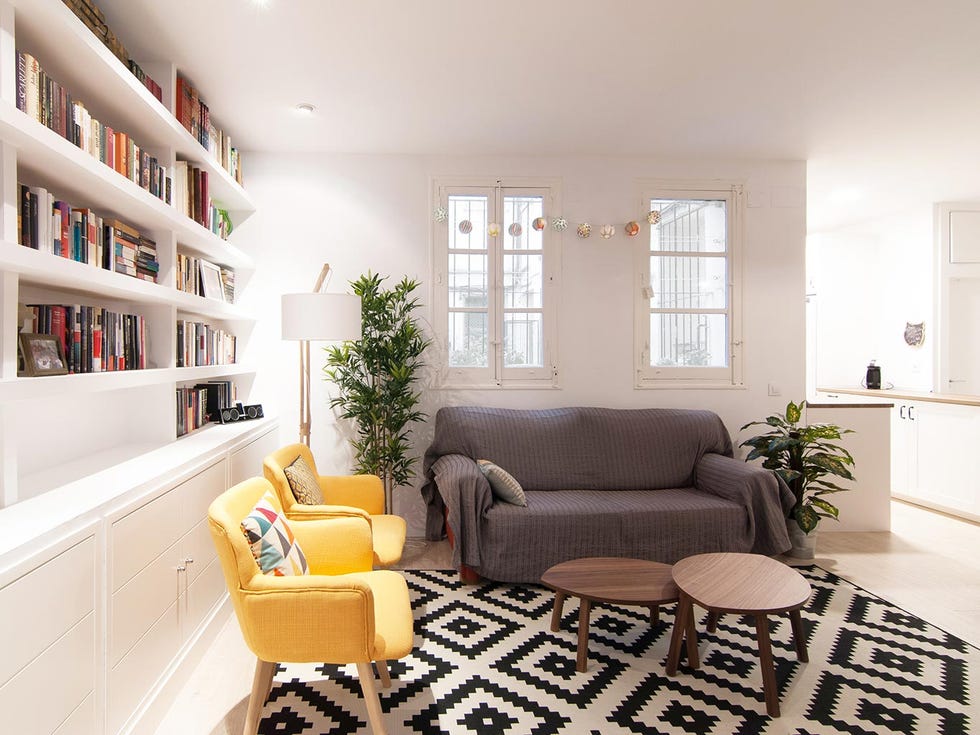 Living room, Furniture, Room, Interior design, Property, Yellow, Shelf, Floor, Building, Couch, 