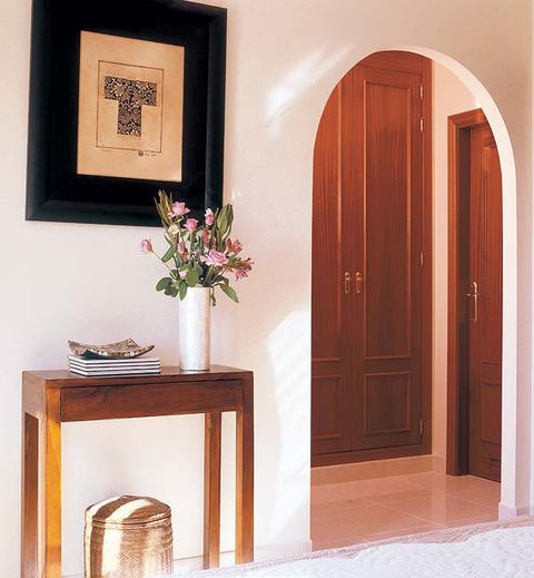 Wood, Door, Hardwood, Home door, Table, Wood stain, Picture frame, Fixture, Interior design, Bouquet, 