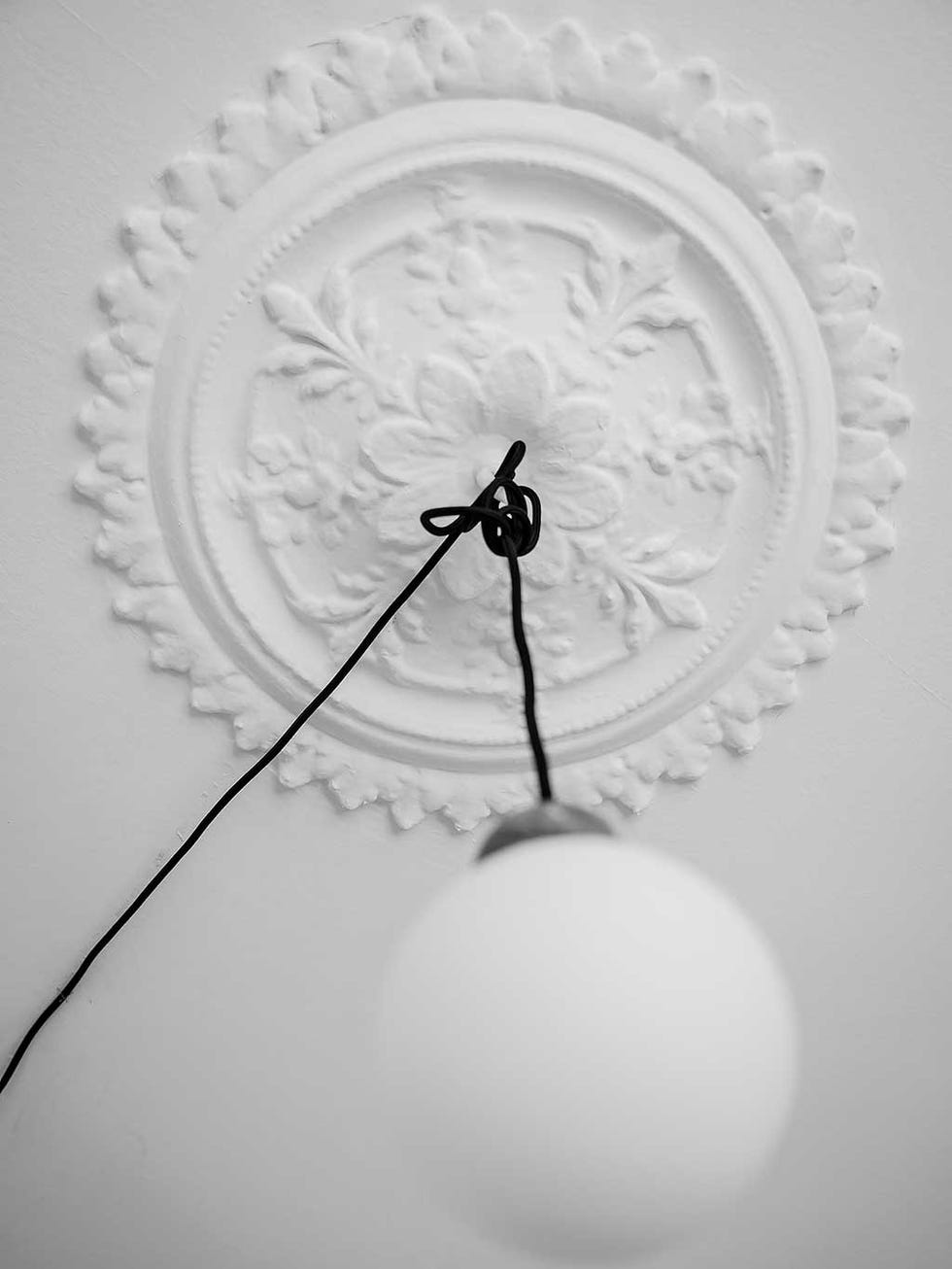 White, Black-and-white, Monochrome, Monochrome photography, Clock, Still life photography, Photography, Light fixture, Circle, Shadow, 