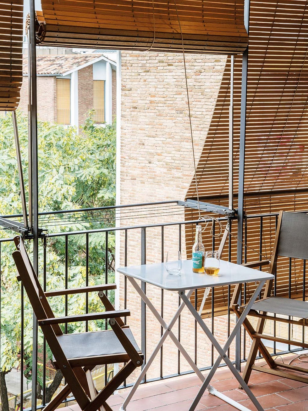 Furniture, Table, Chair, Real estate, Outdoor table, Outdoor furniture, House, Home, Shade, Window covering, 