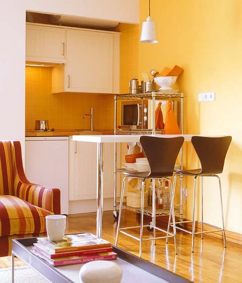 Room, Wood, Interior design, Yellow, Floor, Flooring, Serveware, Furniture, Cupboard, Orange, 