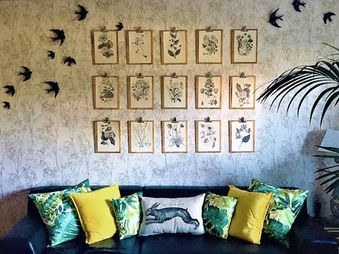 Wall, Room, Yellow, Couch, Furniture, Interior design, Living room, Wallpaper, Font, Design, 