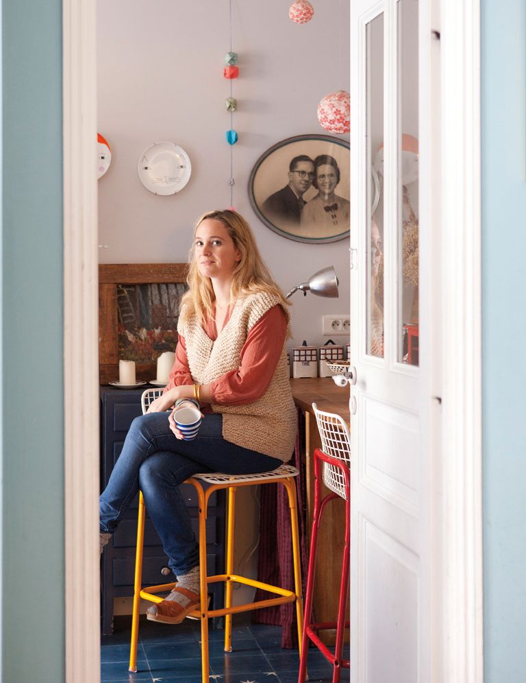 Jeans, Denim, Sitting, Wall clock, Stool, Interior design, Bar stool, Door, Clock, 