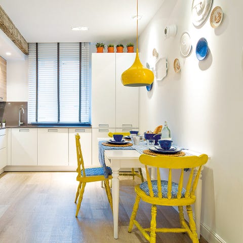 Room, Yellow, Interior design, Floor, Table, Flooring, Ceiling, Furniture, Dining room, Light fixture, 