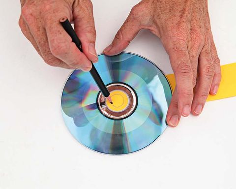 Finger, Hand, Colorfulness, CD, Data storage device, Circle, Blank media, Dvd, Nail, Paint, 