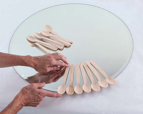 Finger, Wrist, Gesture, Thumb, Natural material, Kitchen utensil, Circle, Chemical compound, Cutlery, Paper, 