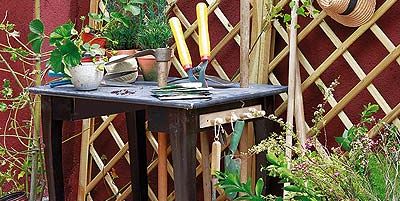 Wood, Wood stain, Hardwood, Flowerpot, Outdoor table, Pottery, End table, Creative arts, Herb, Houseplant, 