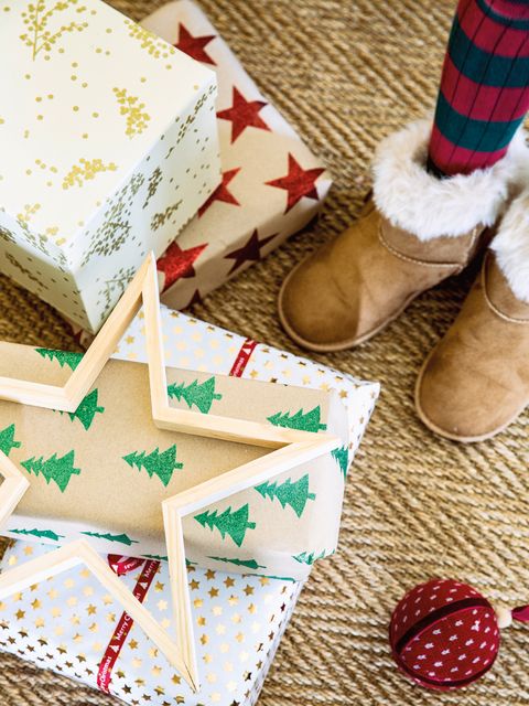 Christmas stocking, Christmas decoration, Footwear, Christmas, Food, Interior design, Dessert, Shoe, Gingerbread, Christmas ornament, 