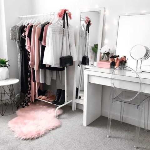 Room, Clothes hanger, Pink, Furniture, Floor, Interior design, Chest of drawers, Flooring, Table, Dress, 